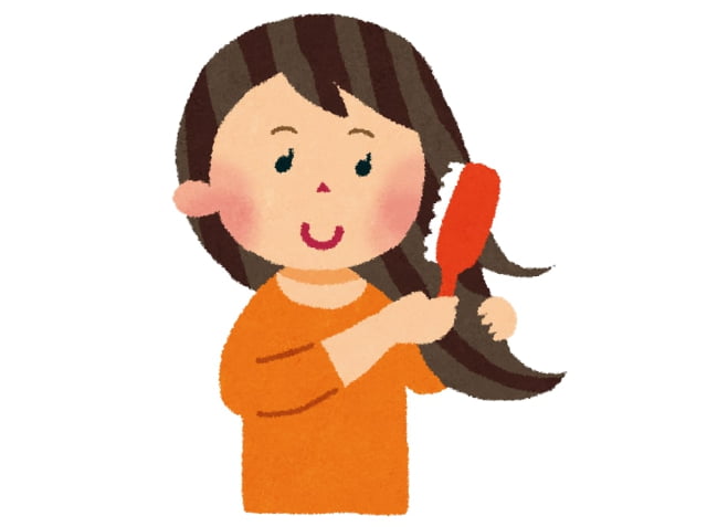 髪をブラッシングする女性のイラスト
