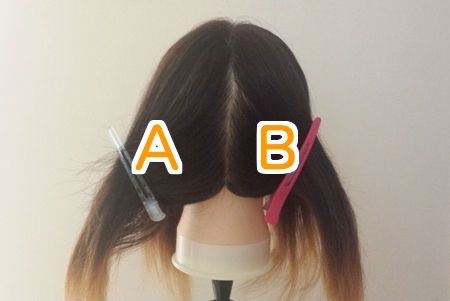 髪の毛を染めるために4つのブロックに分けてＡＢの文字を入れた写真　後ろ姿