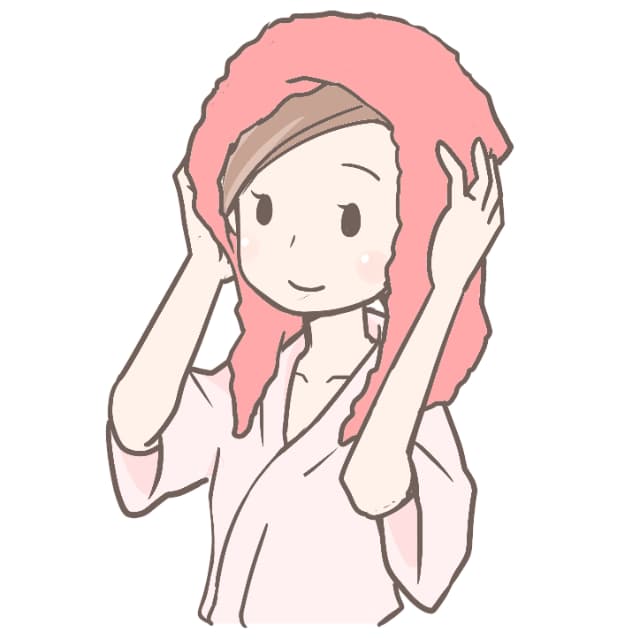 髪をタオルで拭いている女性